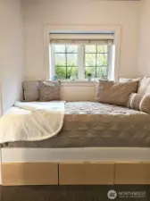 The decorative daybed with storage fits this space like a glove and is included in the sale.