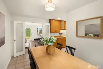 French doors lead from living room to kitchen, dining room and family room.