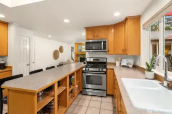 The 2nd door to the left leads to the garage, where there is an additional room built in one of the garage bays. Extra space for office, gym, bedroom, craft room, shop, or even turn it back into a garage bay?