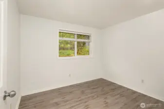 Bedroom #5 looks out to the back yard.