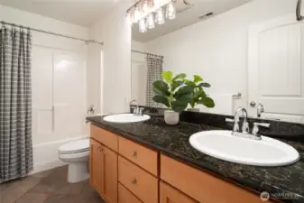 Hall bathroom with double sinks