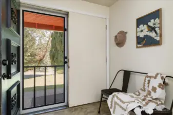 Generous entry way with coat closet and room for bench.