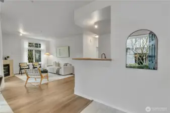 LVP flooring throughout living room, kitchen and hallway.