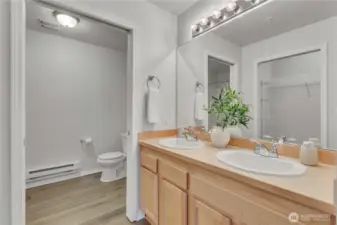 Double Vanity with plenty of storage is accessed just off the primary suite.