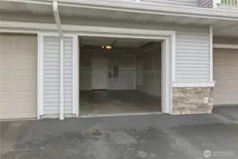 Attached single car garage with additional stoarge.