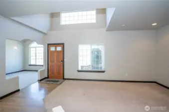 A bright, light-filled entry welcomes you in, setting the tone with an open feel and an inviting first impression.