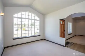 A large window fills the living area with natural light and enhances the space with an airy feel.