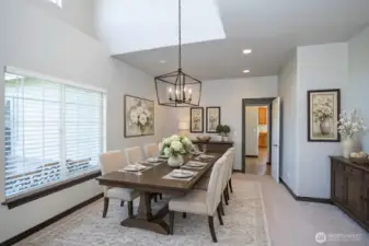 Dining area conveniently located just off the kitchen, virtually staged to highlight its spacious and functional layout.