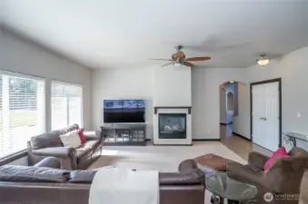 Family room featuring a gas fireplace that provides warmth and a comfortable, inviting atmosphere.