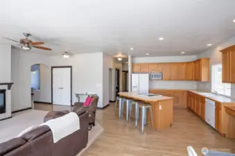 Spacious open-concept layout connecting the kitchen and family room, ideal for comfortable living and entertaining.