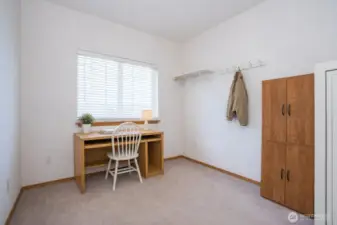 Ideal space for a home office or den, offering versatility and comfort.