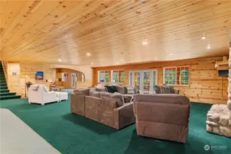 from living room fireplace looking towards the spacious dining room and staircase to upper four Primary suites each with separate view balconies.