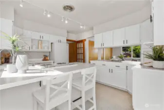 Big bright kitchen w/ tons of cabinets.