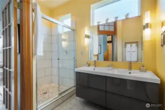 Lower level bath with huge walk in shower. 11' ceiling.