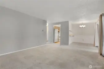 Another view of the living room facing the dining room and kitchen. This unit has a really nice flow.