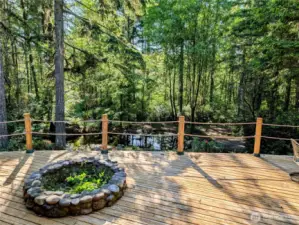 Fire pit on the deck overlooking the pond.