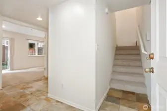 From the front door, the first bedroom is to the left.  Nice stone flooring.
