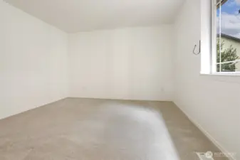 No virtual staging in the primary bedroom. New carpet!