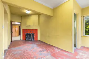 Flex space off kitchen with wood burning fireplace.