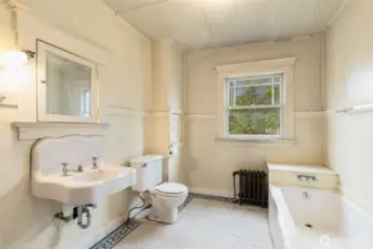 Full bath on upper - original tiled floor