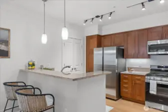 . . as well as informal eating bar with pendant lighting  . . .