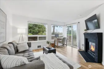 Living room with a cozy wood burning fireplace