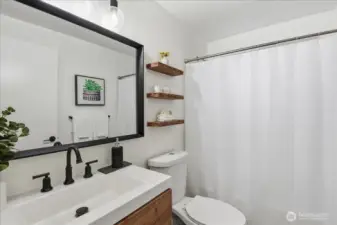 Full bathroom with shower and tub