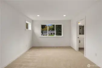 Primary Suite:  Soft natural light fills the primary suite from both a wide rear-facing window and a higher side window that adds privacy while maintaining brightness. The room’s generous proportions comfortably accommodate multiple furniture layouts and create a calm, open retreat at the end of the day. Set within Bothell’s well-connected Canyon Park area, the suite benefits from nearby parks, easy commuter access, and a quiet residential setting that enhances everyday Northwest living. An attached sitting room extends the suite’s livability, offering a flexible place to unwind, read, or create a personalized corner of comfort.    These photos are from Lot 5 at Gooden Hollow, the home listed here. However, other homes in the community will have changes, so all photos, renderings, site maps, and floorplans are for visualization purposes only. Plans, colors, building orientation, finishes, home outlook, and other details can and WILL vary.