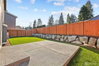 Backyard:  The fully fenced backyard offers a wide lawn, handsome rockery, and a sense of privacy enhanced by mature evergreens beyond the fence line. With plenty of level space, it’s ideal for outdoor relaxation, gatherings, or quiet moments at home. Located in the heart of Bothell near Canyon Park and local trail systems, this yard captures the best of Pacific Northwest outdoor living. The large patio extends the home’s usable space, perfect for dining, grilling, or year-round enjoyment.    These photos are from Lot 5 at Gooden Hollow, the home listed here. However, other homes in the community will have changes, so all photos, renderings, site maps, and floorplans are for visualization purposes only. Plans, colors, building orientation, finishes, home outlook, and other details can and WILL vary.