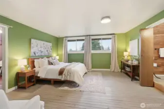 Two primary suites featuring attached bathrooms and large closets.