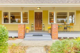 Oversized front porch with historic charm and character.