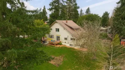 Spacious home, multiple outdoor living spaces, mature landscaping, and a nearly half acre lot. This property has it all!