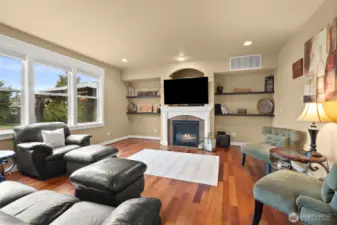 Light-filled living room with natural gas fireplace for year-round comfort.