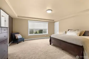 Private primary retreat overlooking the landscaped yard.