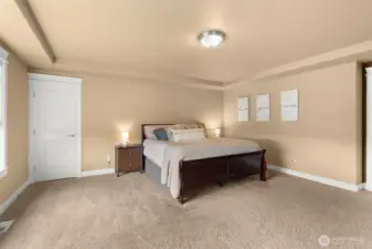 Primary with a small walkin closet, aside from large walk in closet.