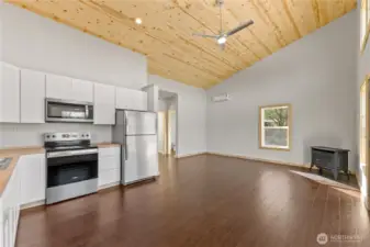 Open floor plan and high ceilings create a spaciousness and simplicity. Propane stove and mini splits for comfortable living.