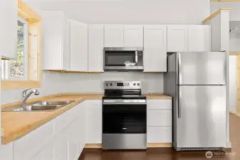 Stainless steel appliances in this new home- clean, bright and ready for you!