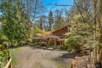 Surrounded by 1.23 acres of private, woodsy landscape