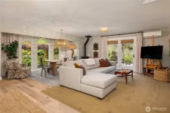 Double doors invite you from the living and dining area out to one of the decks