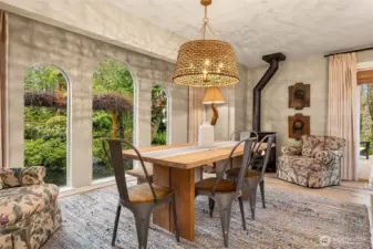 Enjoy garden views from the dining area, framed by elegant arched windows