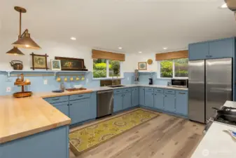 Charming details in spacious kitchen featuring stainless appliances and ample cabinetry