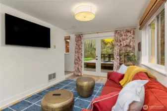 French doors lead to a patio with deck for garden entertaining