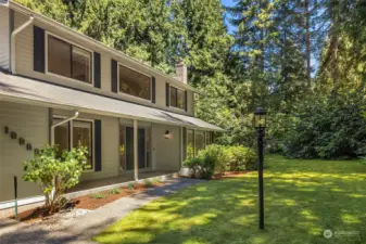 A bright, remodeled 4 bedroom home on a private and peaceful shy-acre lot