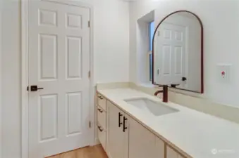 Here is 2nd bathroom with door to 3rd bedroom.  It has large newly updated vanity with quartz stone counters under mount sink and oil rubbed fixtures to enjoy