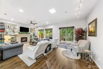 Great room with slider out to back deck and lovely forest view