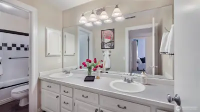 Convenient full bath with dual sinks and private bathing area adjacent to all 3 secondary bedrooms.