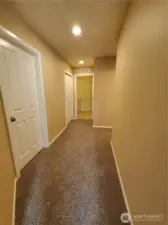 Spacious hallways connect all bedrooms, bathrooms and laundry room. Brand new carpets too!