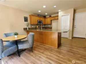 Closer view of the dining area and kitchen.