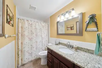 Upper level full bathroom has been remodeled with granite counters and subway tile back splash.