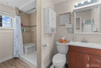 Primary bathroom attached to the main bedroom with a tile shower.